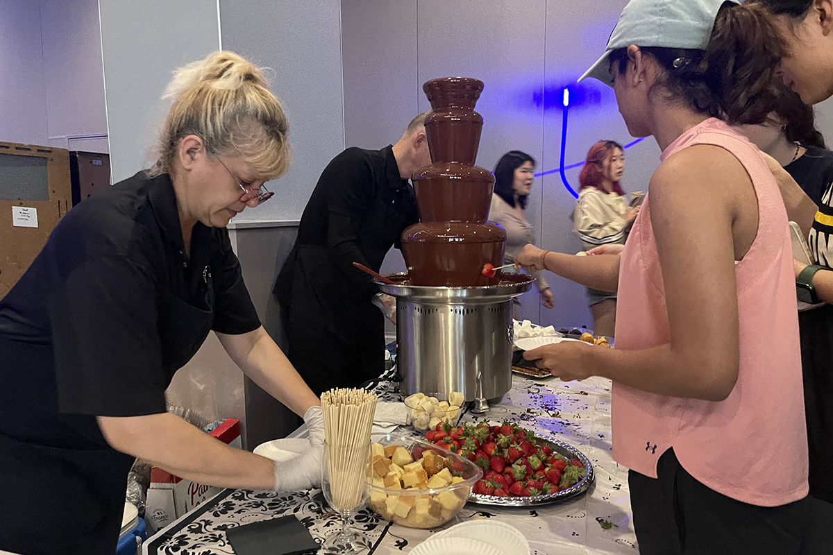 A student and a choclate fondue fountain